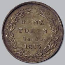 A coin with writing on it

Description automatically generated with low confidence